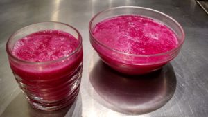 Glass and bowl of cold borscht